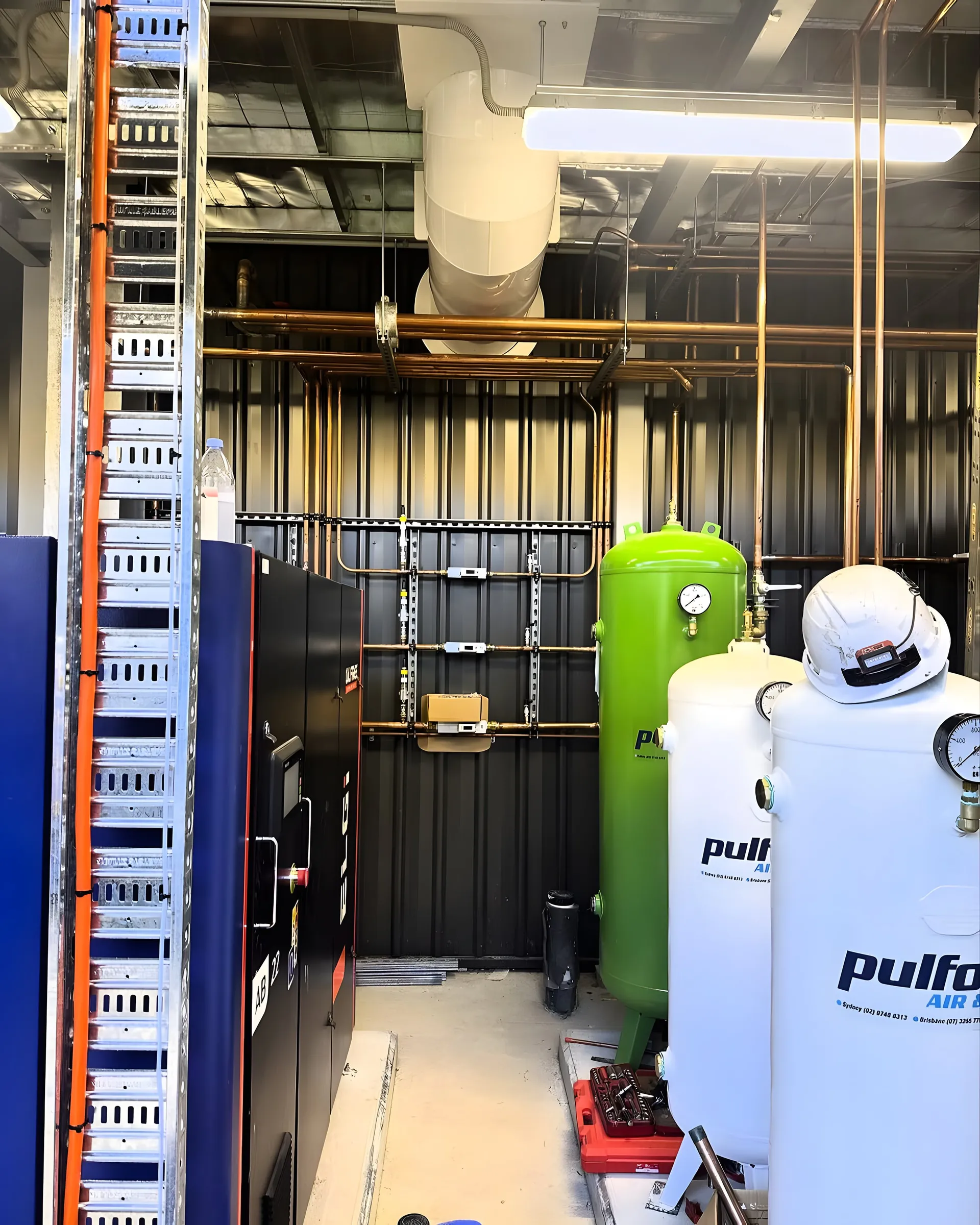 Plant room with air receivers and cable tray